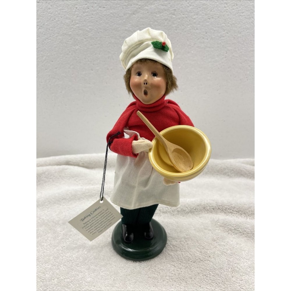 Byers choice caroler baking cookies with mixing bowl